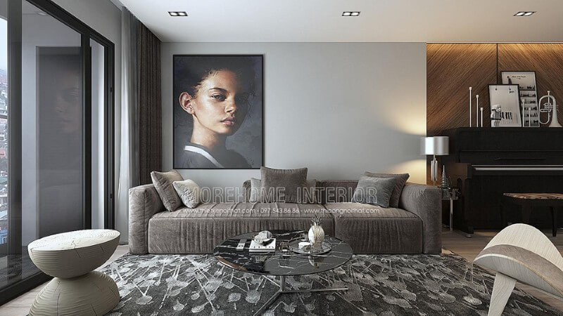 Chiếc sofa dài bằng nỉ màu xám kết hợp chiếc bàn trà màu đen đặt trên chiếc thảm màu xám trắng mang đến không gian mát mẻ Thiết kế nội thất phòng khách chung cư đơn giản, hiện đại