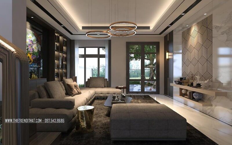 Phòng khách nhà phố đầy ấm cúng với tâm điểm là bộ sofa hiện đại kiểu dáng góc tối ưu diện tích được bọc vải êm ái màu xám tinh tế. Ấn tượng các mẫu sofa phòng khách độc đáo nhất