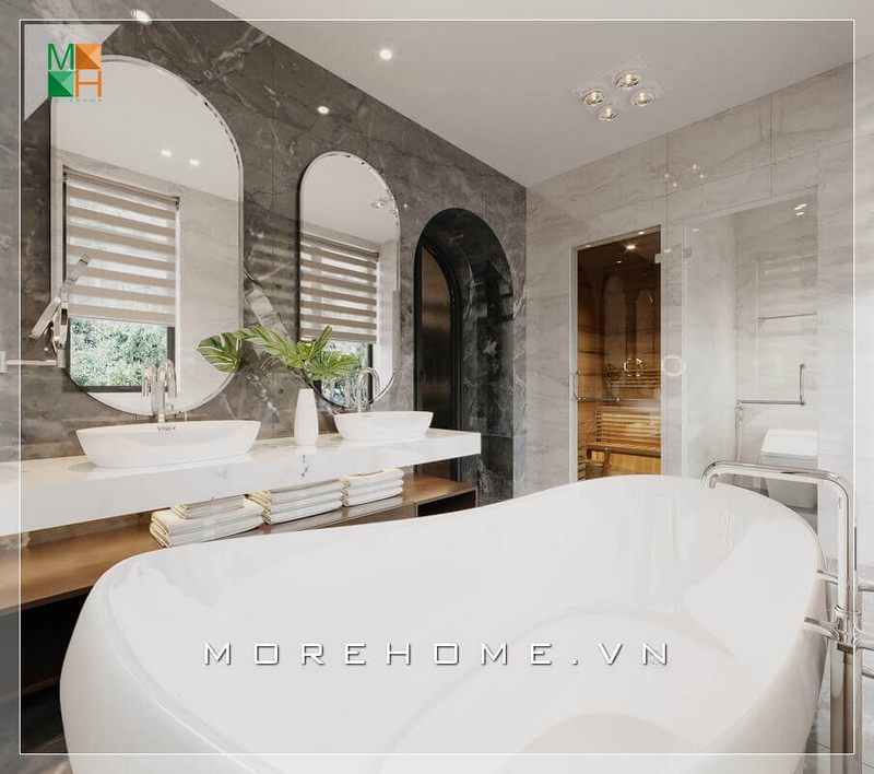 Hai mẫu gương lớn có hình bầu giục sẽ làm cho không gian phòng tắm trở nên tiện nghi và thoáng mát.